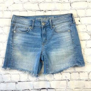 American Eagle Woman’s Super Stretch X Blue Midi Denim shorts size 4 Raw Hem